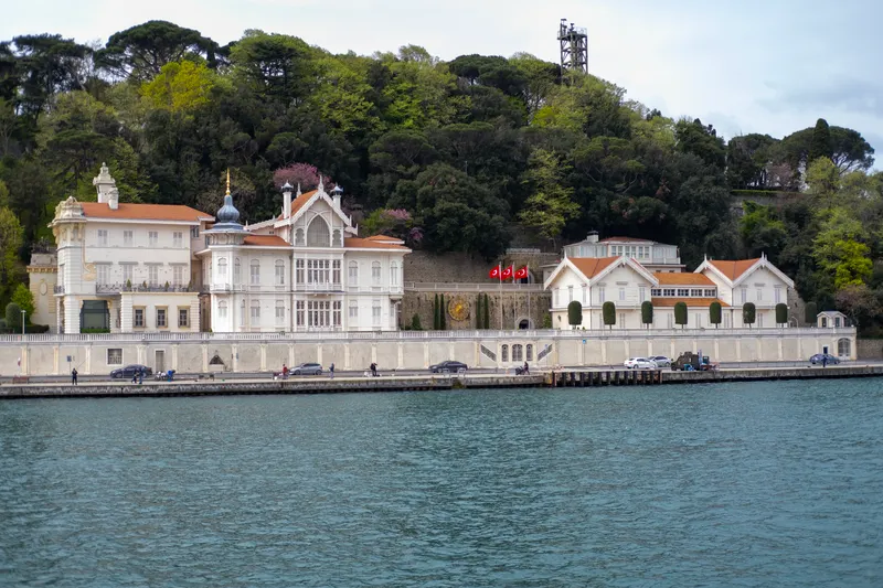 An intimate ceremony at a Bosphorus waterfront mansion wedding, highlighting the unique architectural features and scenic backdrop.