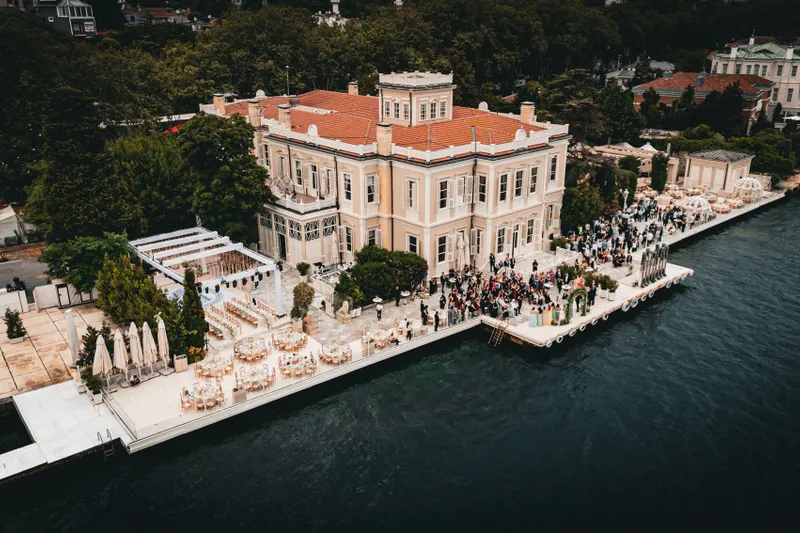 An elegant garden setup at a Kayaköy wedding venue, featuring floral arrangements and seating, ideal for outdoor ceremonies.
