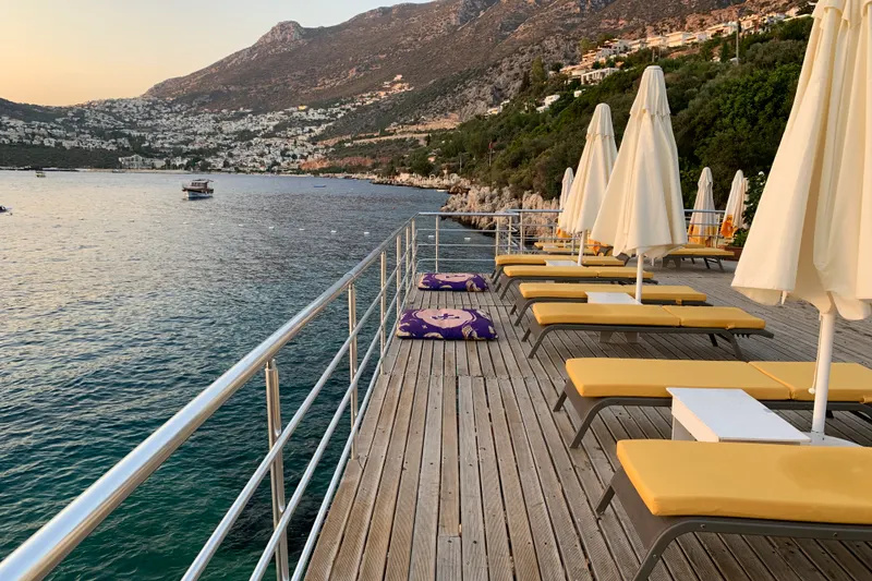 A picturesque beach setting highlighting the differences between Fethiye vs Kalkan for a destination wedding, perfect for couples.