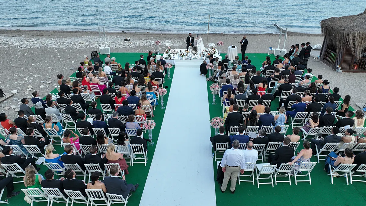 Aerial view of a real Persian beach wedding ceremony coordinated by Ramarossi in Antalya