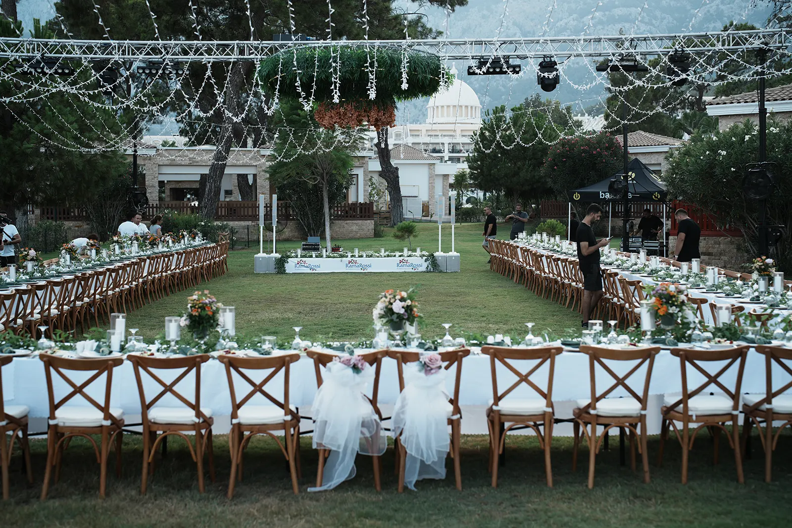 Outdoor wedding reception setup being prepared by Ramarossi in Turkey