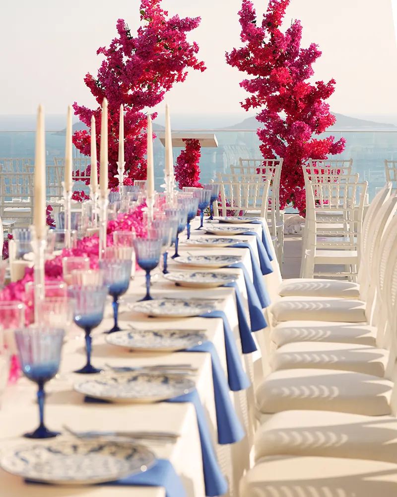 Custom ceremony and reception styling with pink florals and blue table details at a Ramarossi wedding