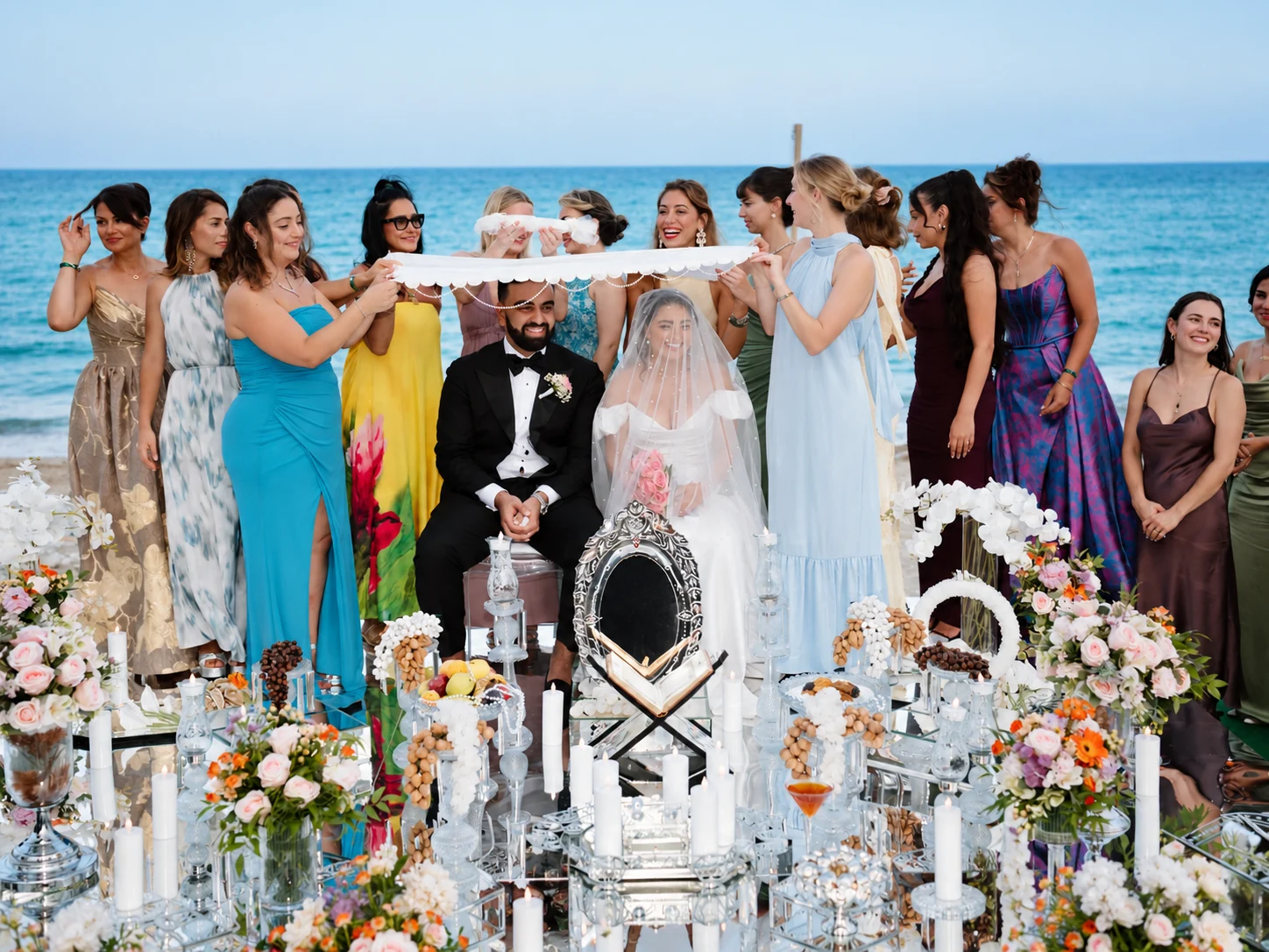 Family members holding the ceremonial cloth above the couple during a Persian Sofreh Aghd in Antalya
