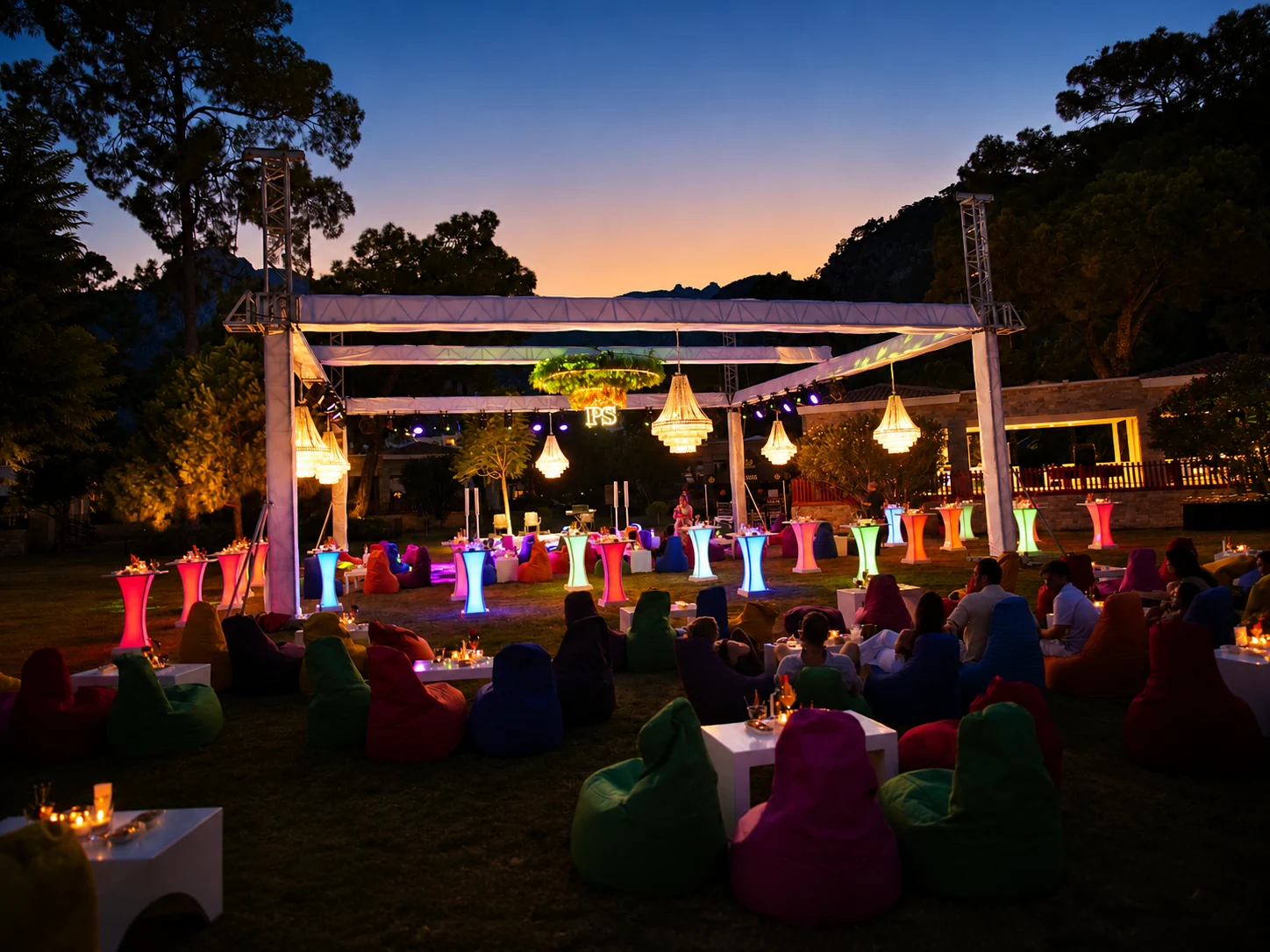 Evening farewell lounge with chandeliers and illuminated cocktail tables at a Persian wedding in Antalya
